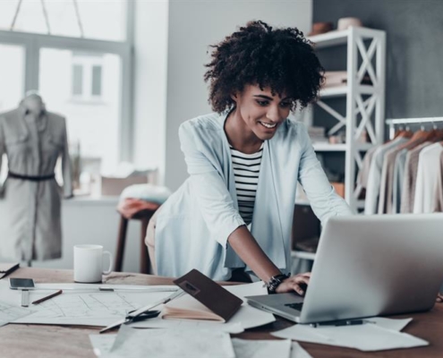 Businesswoman in shop on computer